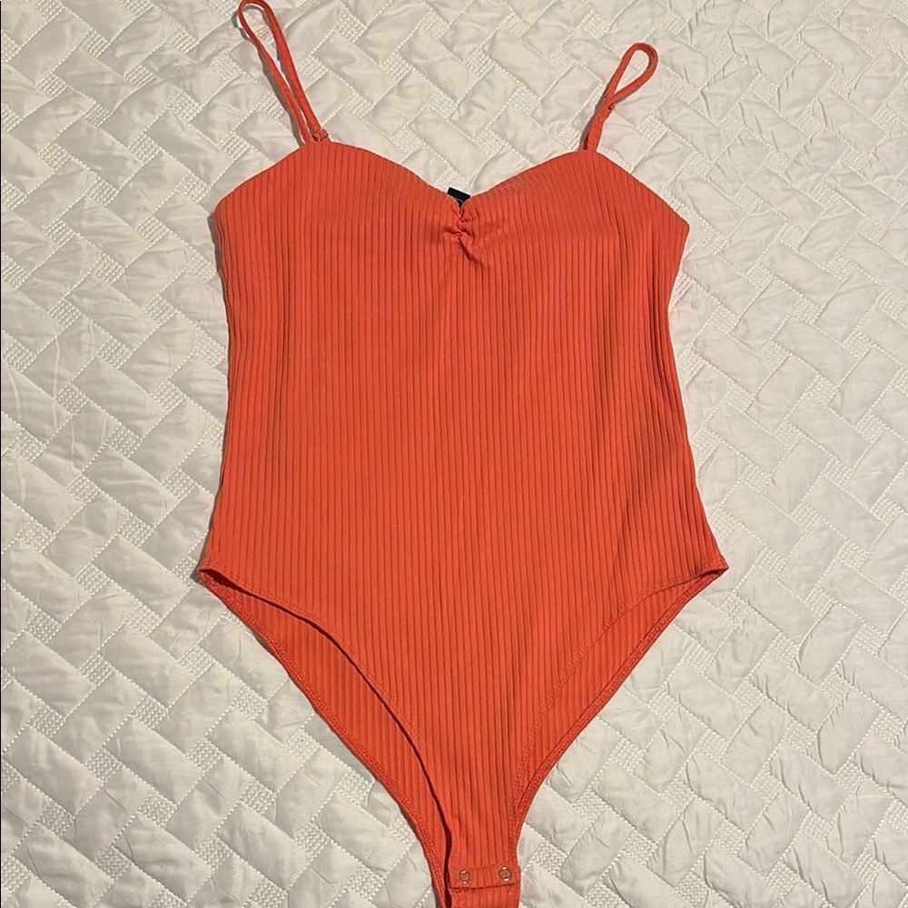 Women’s Orange Body Suit. *worn a few times.